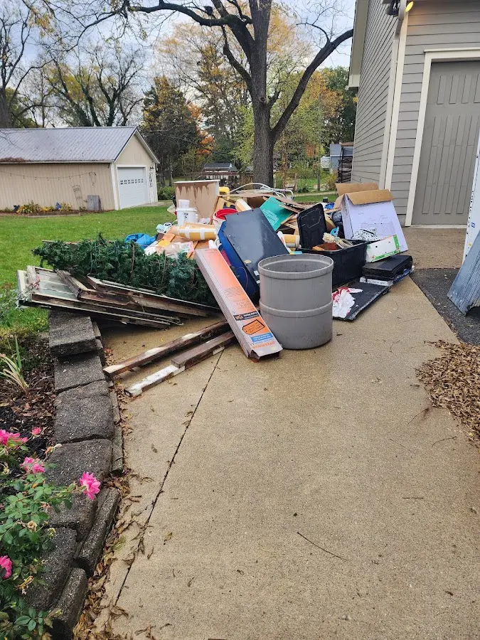 Dumpster being loaded with debris for Roofing Dumpster Rental in Halifax